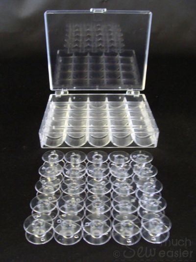 25 Empty Plastic Bobbins + Storage Box