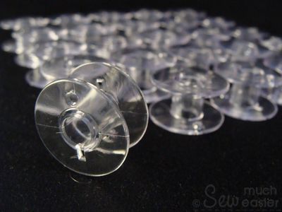 25 Empty Plastic Bobbins + Storage Box