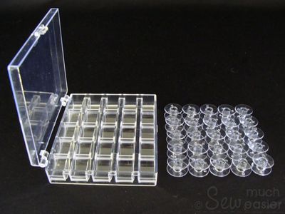 25 Empty Plastic Bobbins + Storage Box