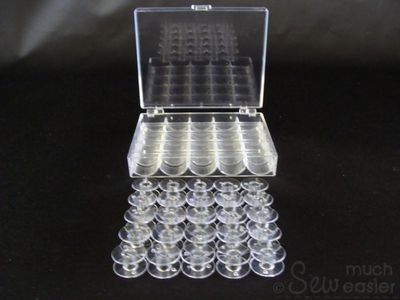 25 Empty Plastic Bobbins + Storage Box